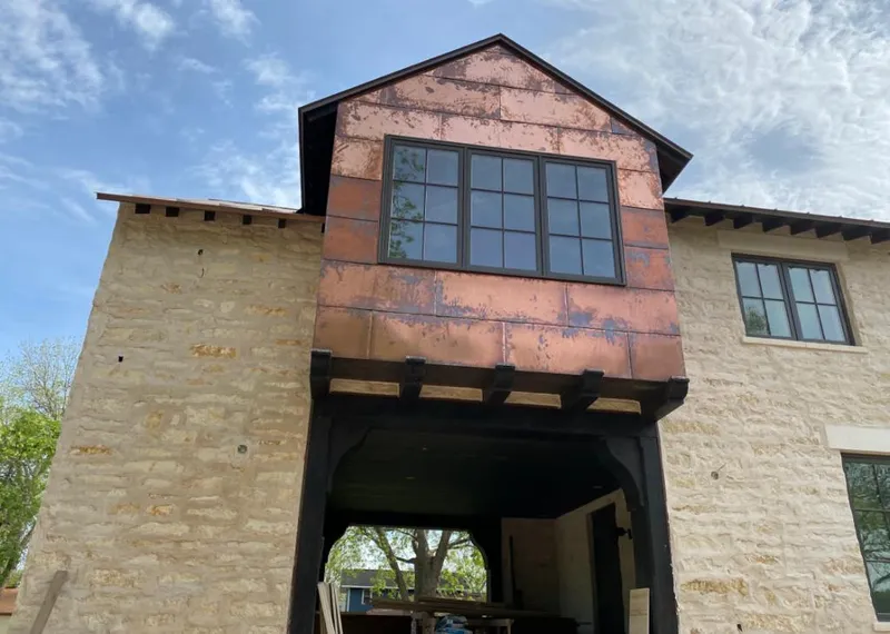 Copper metal panel facade on a stone building for Metal Roof Coating in Pikeville